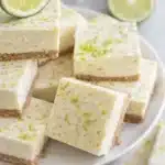 No bake margarita cheesecake bites with lime zest on a plate