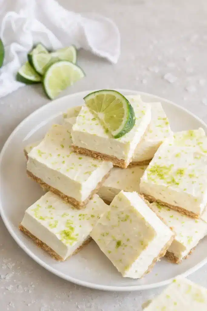 No bake margarita cheesecake bites with lime zest on white plate
