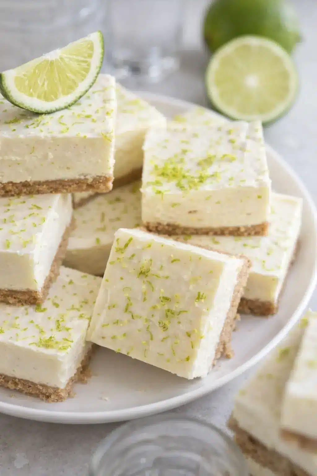 No bake margarita cheesecake bites with lime zest on a plate