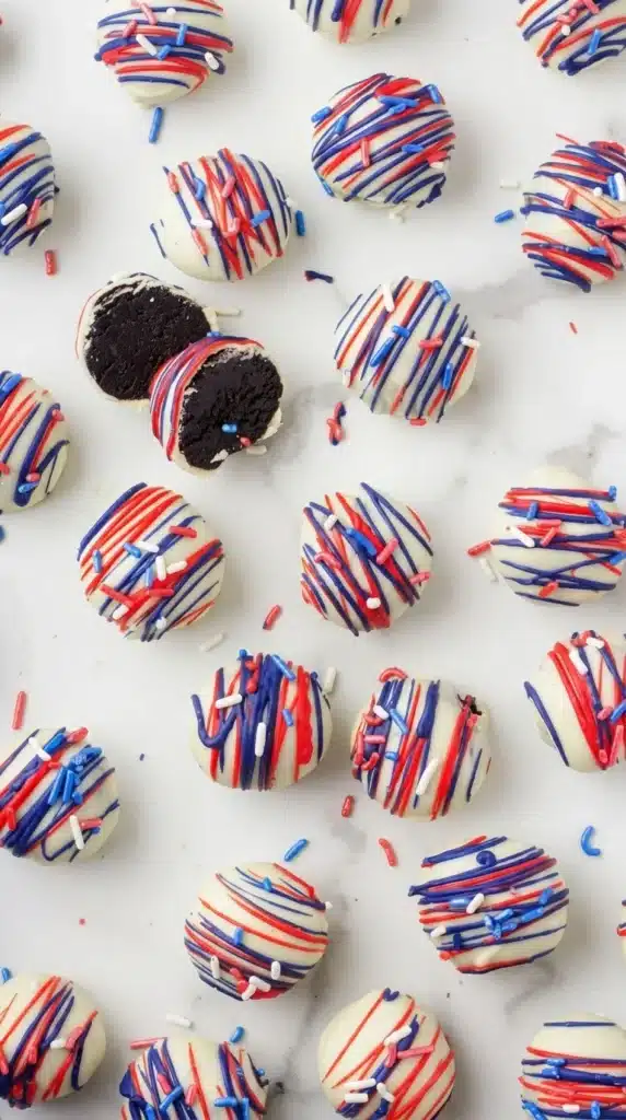 Patriotic Oreo Balls with white chocolate coating and visible chocolate center