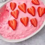 Pink fluff recipe with fresh strawberries in a creamy no bake dessert
