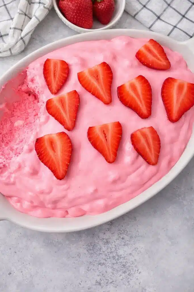 Pink fluff recipe with fresh strawberries in a creamy no bake dessert