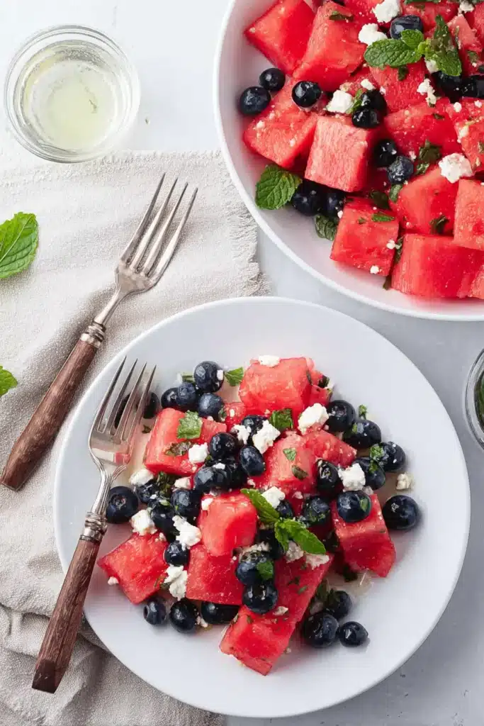Watermelon Feta Salad plated with blueberries, feta, and mint