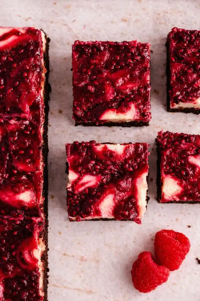 Raspberry Cheesecake Brownies Irresistible Treat 6 Raspberry Cheesecake Brownies with glossy raspberry swirl and fudgy base