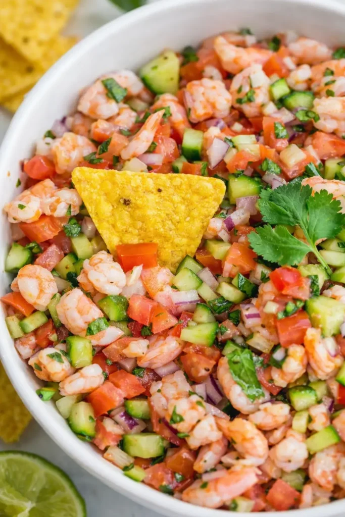 Shrimp ceviche recipe close up with tortilla chip and fresh vegetables