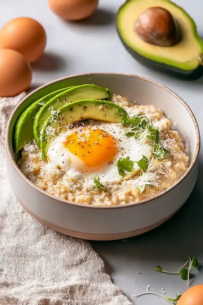 Simple Savory Avocado Oatmeal with poached egg and sliced avocado in bowl