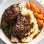 Slow cooker short ribs with mashed potatoes, carrots, and rich brown sauce