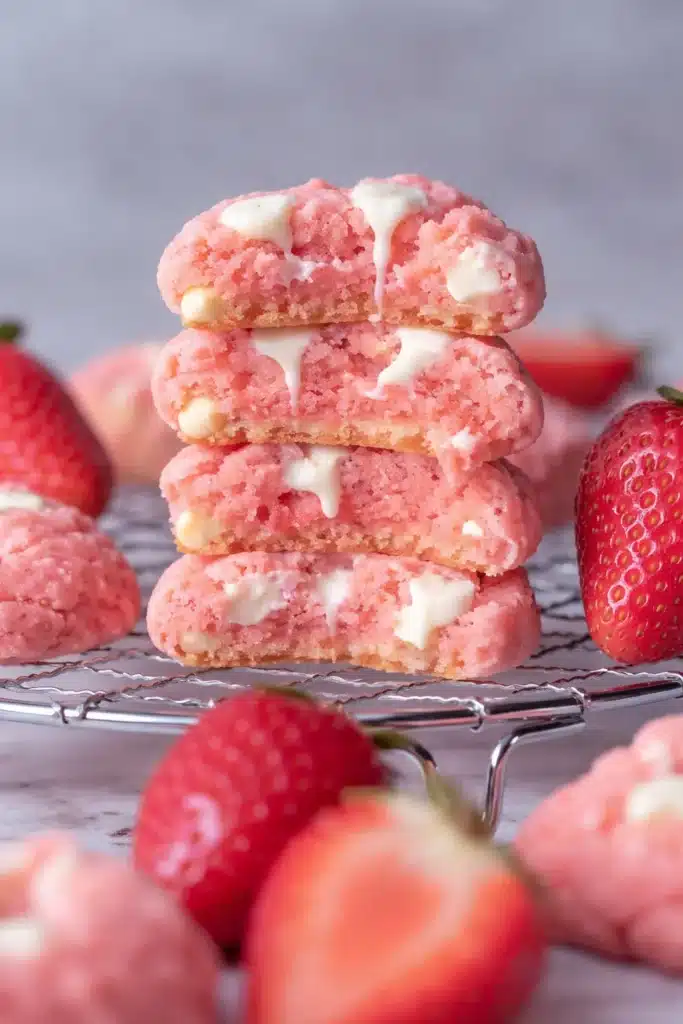 Strawberry Cheesecake Cookies Recipe Easy Amazing Treat 6 strawberry cheesecake cookies with white chocolate chips stacked and broken open