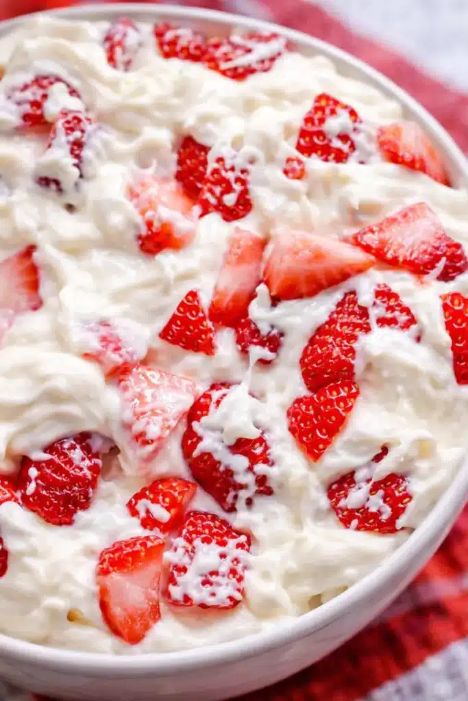 Strawberry cheesecake salad with creamy texture and fresh strawberries in a bowl