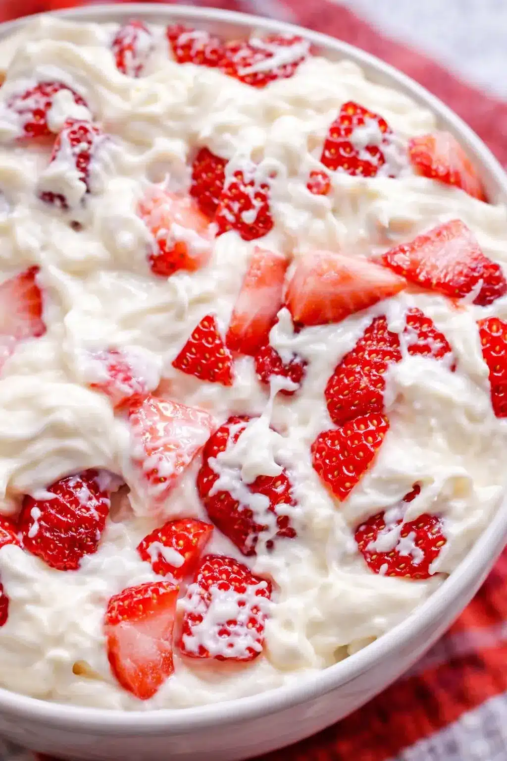 Strawberry cheesecake salad with creamy texture and fresh strawberries in a bowl
