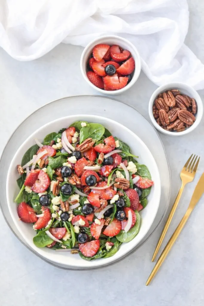 Strawberry Spinach Salad with Feta Fresh Easy Favorite 6 Strawberry Spinach Salad with Feta served with berries and pecans on a plate