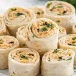 Creamy taco pinwheels made with tortillas and cheesy filling on a plate