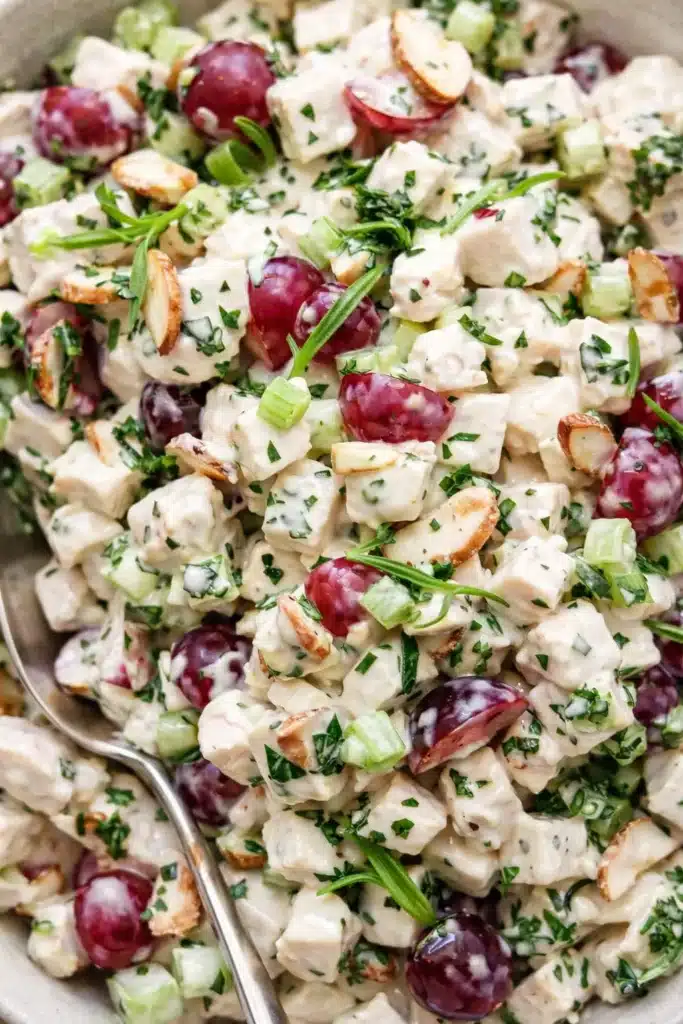 Ultimate chicken salad with grapes, celery, and almonds in creamy dressing