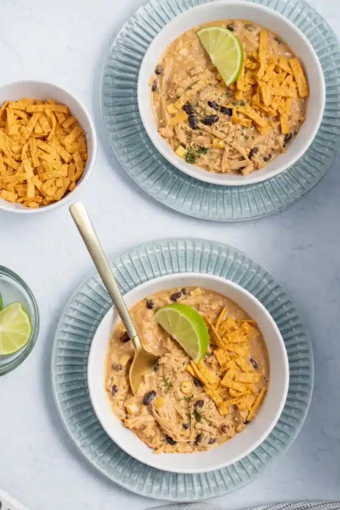 White Chicken Chili Recipe Easy Creamy Comfort Meal 6 White Chicken Chili Recipe with tortilla strips and lime served in bowls