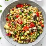 10-Minute Mediterranean Chickpea Salad Easy Amazing Dinner 9 10-Minute Mediterranean Chickpea Salad with feta, cucumber, olives, and tomatoes in a rustic bowl