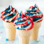 4th of July ice cream cone cupcakes with red white blue frosting and sprinkles