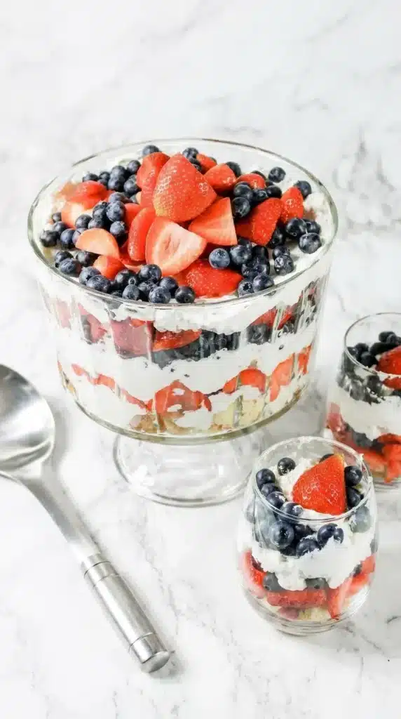  4th of July Berry Trifle layered with strawberries, blueberries, cream, and cake