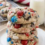 4th of July cookies with Oreo chunks and red white blue M&Ms stacked on plate