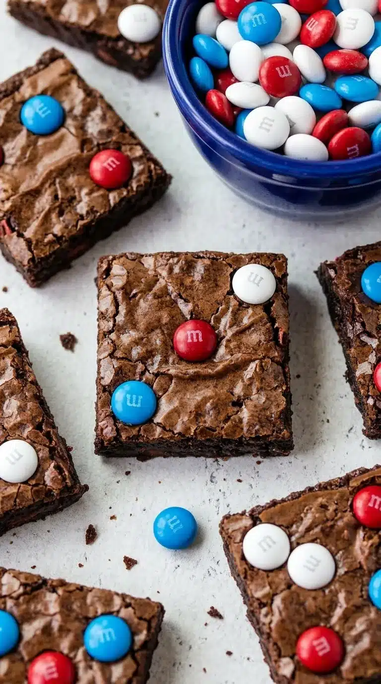 Fudgy 4th of July brownies topped with red white and blue candy chocolates