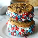 Patriotic Ice Cream Sandwiches with cookies and red white blue sprinkles