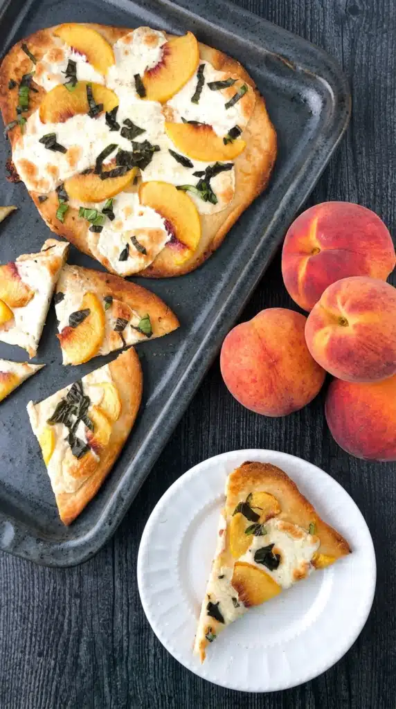 Peach & Basil Naan Bread Pizza served with fresh peaches and basil