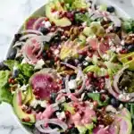 Blueberry Pistachio Spring Salad with avocado and pink dressing