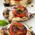 Chicken Caprese with melted mozzarella, tomato, basil, and balsamic glaze
