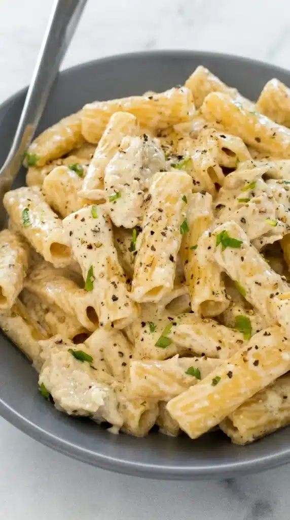 Crockpot Chicken Alfredo Recipe for Creamy Weeknight Comfort 4 Creamy Crockpot Chicken Alfredo with penne pasta and tender chicken