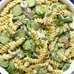 Creamy Cucumber Pasta Salad with rotini, cucumbers, dill, and red onion in a serving bowl