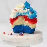 Easy 4th of July cupcakes with red white and blue layers and creamy frosting