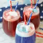 Easy 4th Of July punch with red white and blue sorbet in festive summer party glasses