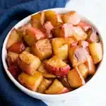 Easy cinnamon apples in a bowl with warm caramelized glaze and soft apple chunks