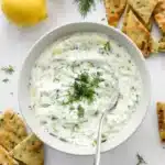 Easy healthy tzatziki sauce with Greek yogurt, cucumber, dill, and pita chips