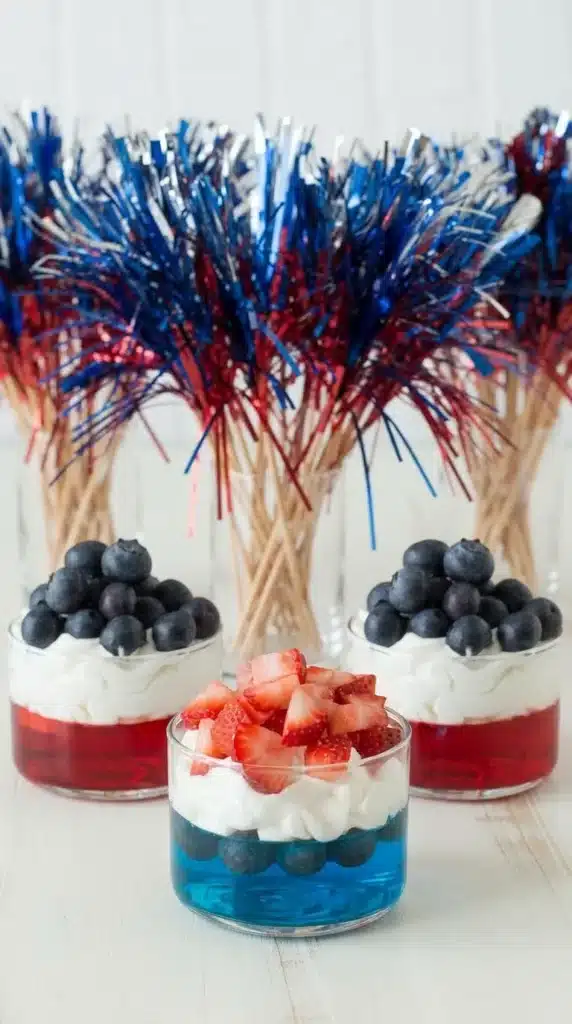 4th of July Fruit & Jello Cups topped with whipped cream and blueberries