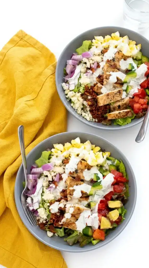 Chicken Cobb Salad with grilled chicken, avocado, bacon, eggs, and ranch dressing