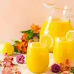 Fresh Mango Lemonade in glasses with lemon slices
