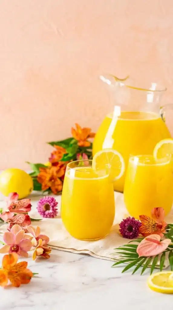 Fresh Mango Lemonade in glasses with lemon slices