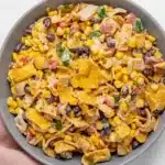 Frito Corn Salad with corn, black beans, cheese, and crunchy corn chips in creamy dressing