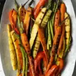 grilled vegetables marinade with carrots zucchini asparagus and peppers on plate