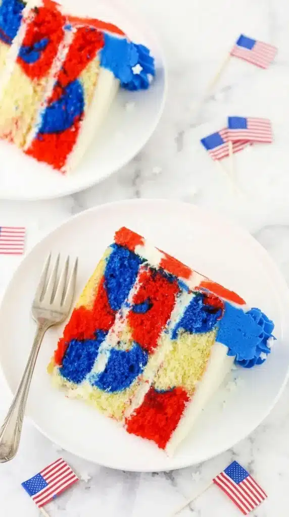 July 4th Marble Cake Recipe That Looks Amazing 6 Slice of July 4th Marble Cake with red white and blue swirls and buttercream frosting