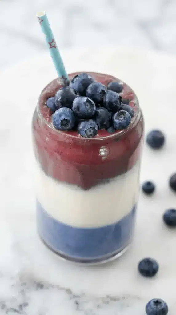 Dye-Free Red, White and Blue Smoothie topped with fresh blueberries