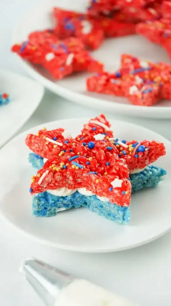 4th Of July Rice Krispie Treats That Everyone Loves 12 4th Of July Rice Krispie Treats with red and blue star sandwich layers