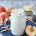 Creamy peaches and cream protein smoothie with chia seeds and fresh peaches