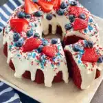 Red Velvet 4th of July Cake with cream cheese glaze and fresh berries