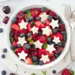 Red, White and Blue Fruit Salad with berries, watermelon, and star shaped fruit for July 4th