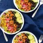Shrimp avocado salad with blackened shrimp, black beans, corn, and fresh avocado slices