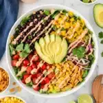 Fresh Southwest Salad with avocado, black beans, corn, and chipotle ranch dressing