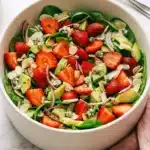 Strawberry Avocado Spinach Salad Amazing Lunch 9 Strawberry avocado spinach salad with almonds, feta, and poppy seed dressing in a ceramic bowl