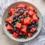 Fresh watermelon blueberry salad with mint in a ceramic bowl for a healthy summer fruit side dish