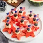 Watermelon stars with cheese and blueberries on a patriotic Fourth of July party platter